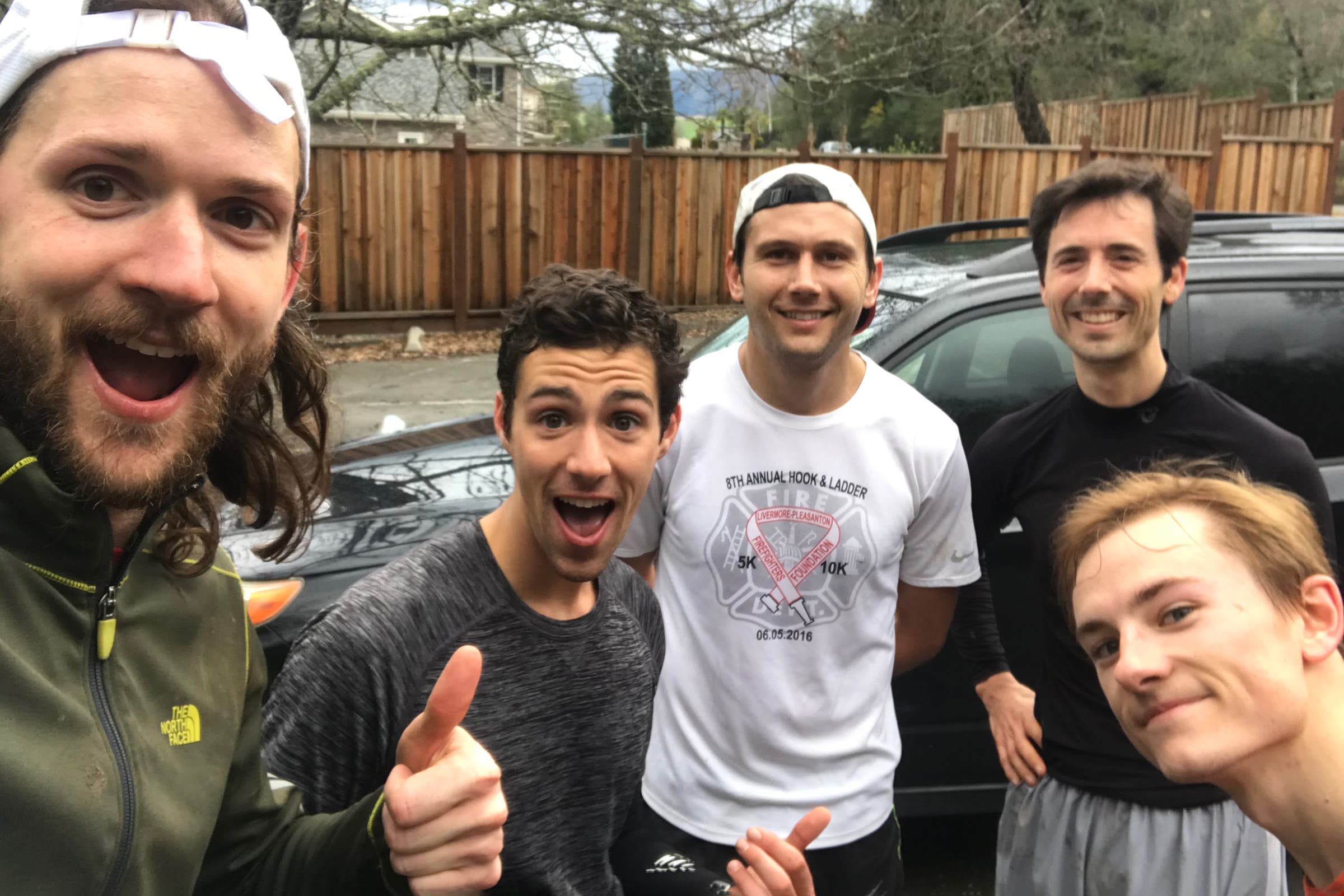 Chris Thoburn, far left, and Philip Kreycik, rear right, pause for a photo with friends before a group run at Las Trampas Regional Park in the East Bay.