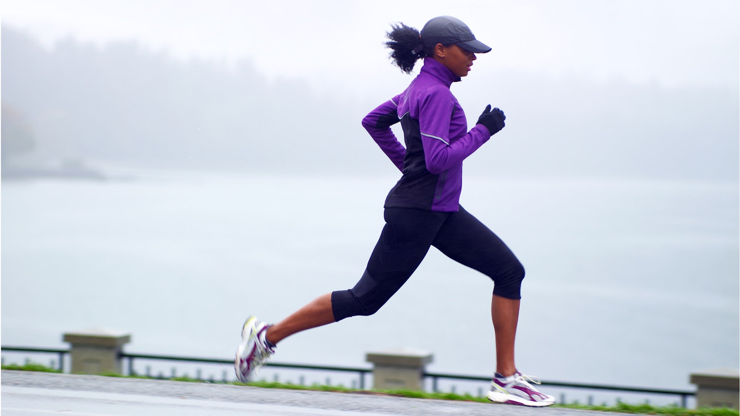woman running in purple shirt